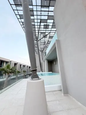 a view of a building with a swimming pool at Modern 2BR House , Pool , 3 Baths, Balconies in Dubai