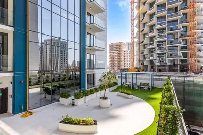 an apartment balcony with a view of a building at Wonderful 1BR Apartment at East Crest in Dubai