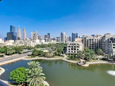 a view of a city with a river and buildings at Vacationer l Spacious Studio l Canal View l The Greens in Dubai