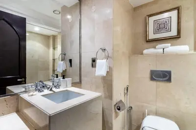 a bathroom with a sink and a shower and a toilet at Luxury Old Town Fountain View 2BHK front of Dubai Mall in Dubai
