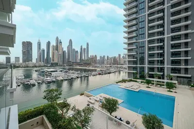 a view of a city skyline with a swimming pool at Beachfront 2BR Marina & Beach Views in Dubai