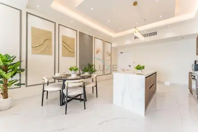 a kitchen and dining room with a table and chairs at Walking Distance To JBR Beach, The Walk, And Marina Mall, With Easy Access To The Metro And The Vibrant Marina Nightlife - DEC Towers 2, Dubai Marina by Deluxe Holiday Homes in Dubai