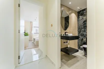 a bathroom with a black sink and a mirror at Walking Distance To JBR Beach, The Walk, And Marina Mall, With Easy Access To The Metro And The Vibrant Marina Nightlife - DEC Towers 2, Dubai Marina by Deluxe Holiday Homes in Dubai