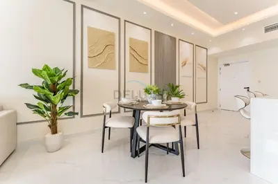 a dining room with a table and chairs at Walking Distance To JBR Beach, The Walk, And Marina Mall, With Easy Access To The Metro And The Vibrant Marina Nightlife - DEC Towers 2, Dubai Marina by Deluxe Holiday Homes in Dubai