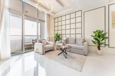 a living room with a couch and a table at Walking Distance To JBR Beach, The Walk, And Marina Mall, With Easy Access To The Metro And The Vibrant Marina Nightlife - DEC Towers 2, Dubai Marina by Deluxe Holiday Homes in Dubai