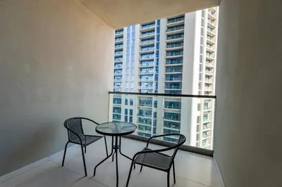 a table and chairs in a room with a window at Aykon City Tower C, Business Bay - Onelink in Dubai