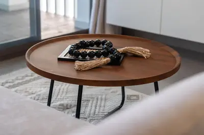 a wooden table with a bunch of beads on it at New, Bright & Modern 4BR Villa in Tilal Al Furjan in Dubai