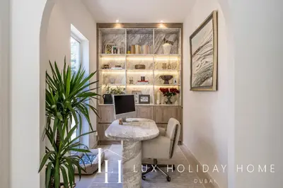 a home office with a desk and a computer at LUX The Serene Springs Villa 3 in Dubai