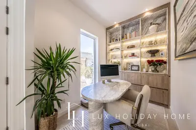 a home office with a desk and a computer at LUX The Serene Springs Villa 3 in Dubai