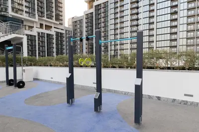a group of poles in a city with buildings at Stylish & Chic 1BR - The Crest at Sobha Hartland in Dubai