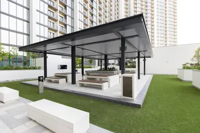 a gazebo with benches and grass in a city at Stylish & Chic 1BR - The Crest at Sobha Hartland in Dubai