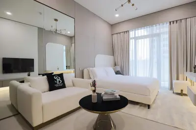 a living room with a bed and a couch at Gracious Studio in Pearl House by Imtiaz in Dubai
