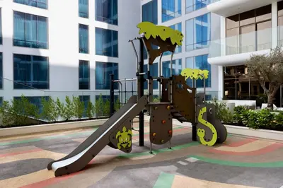 a playground in front of a building at Gracious Studio in Pearl House by Imtiaz in Dubai