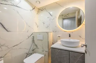 a bathroom with a sink and a mirror at Spacious 2 BDR apartment in Downtown Dubai I 29 Blvd in Dubai