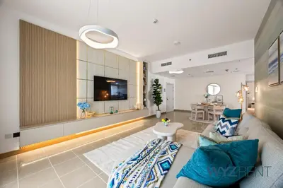a living room with a couch and a table at Salt & Sand Hamptons Glow 2BR Sulafa Tower in Dubai