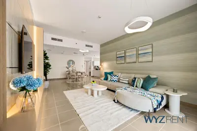 a living room with a couch and a table at Salt & Sand Hamptons Glow 2BR Sulafa Tower in Dubai