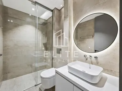 a bathroom with a sink and a mirror at Luxury Ixora Family Villa in Dubai
