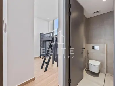 a bathroom with a staircase and a toilet in a room at Luxury Ixora Family Villa in Dubai