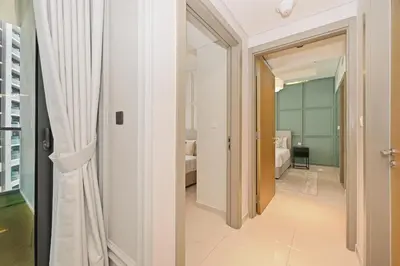 a hallway with a door leading to a bedroom at High Floor 2 Bedroom Apartment - Exclusive Luxury at Aykon Tower - PlayStation 5 in Dubai