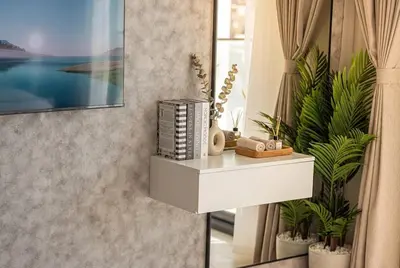 a white shelf in a room with plants at Binghatti Phoenix! Longest Pool in Dubai! Brand New Building, 2 Double Beds! in Dubai