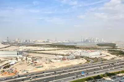 an aerial view of a construction site with traffic at STAY BY LATINEM Luxury 1BR Holiday Home CVG2403 Near Downtown in Dubai