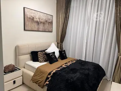 a bedroom with a bed with pillows on it at Luxury Skyline View Apartment - Binghatti Tulip 1401 in Dubai