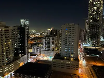 a view of a city at night with buildings at Luxury Skyline View Apartment - Binghatti Tulip 1401 in Dubai