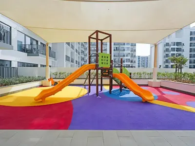 a play area with a slide in a building at Elegant Modern Studio- Peaceful Studio City in Dubai