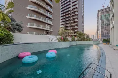 a swimming pool with pink and blue balls in a building at Chic 2Bedroom with Exceptional Facilities in JVC in Dubai