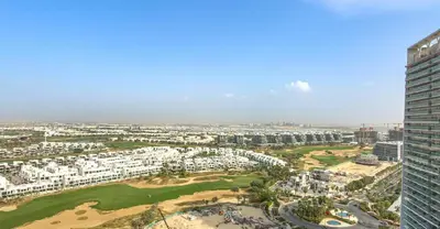an aerial view of a golf course in a city at Serene Golf Course Studio in Artesia Damac Hills in Dubai Marina