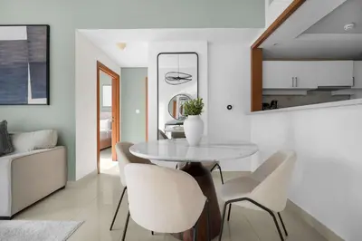 a dining room with a table and chairs at Perfect Getaway in Downtown l Near Dubai Mall in Dubai