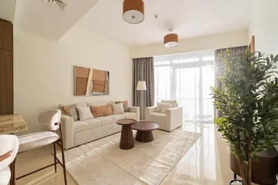 a living room with a couch and a table at Downtown Dubai - Near Burj Khalifa & DWTC-Gulfood - Imperial Avenue in Dubai