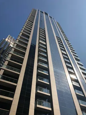 a tall building with a lot of windows at Stylish Deluxe Two Bedrooms In Dubai Marina in Dubai