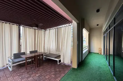 a room with a table and chairs and windows at Spacious 3BR with Large Terrace in Dubai
