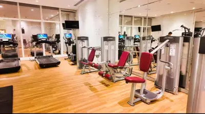 a gym with treadmills and cardio machines at 1BR 42nd Floor Palm Jumeriah & Sea View- 5 Sleeps in Dubai