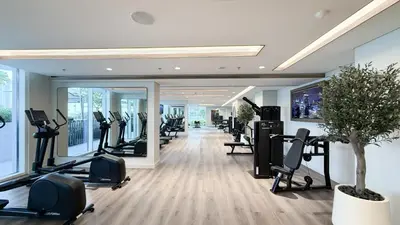 a gym with treadmills and elliptical machines at Beachfront 1BR with Private Beach Access and Balcony in Dubai