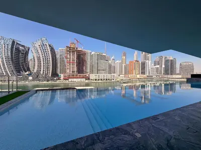 a view of a city skyline from a swimming pool at Frank Porter - Binghatti Canal in Dubai