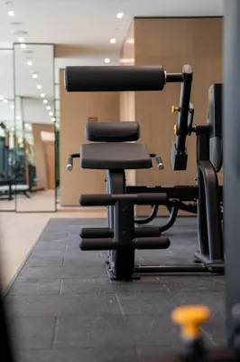 a black office chair sitting in a room at Refined Luxury 1BR Binghatti Azure in Dubai