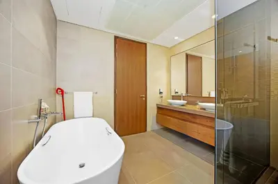a bathroom with a toilet and a sink and a shower at Elegant 1-Bed Apartment with Premium Comforts in Dubai