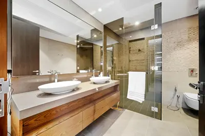 a bathroom with two sinks and a shower at Elegant 1-Bed Apartment with Premium Comforts in Dubai