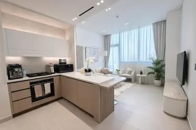 a kitchen with a sink and a stove in a room at Chic 1BR Urban Retreat Binghatti Phantom in Dubai