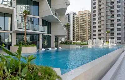 a swimming pool in the middle of a building at Chic 1BR Urban Retreat Binghatti Phantom in Dubai