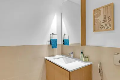a bathroom with a sink and a mirror at Stylish Chic 1BR with Lagoons Access - Creek Beach in Dubai