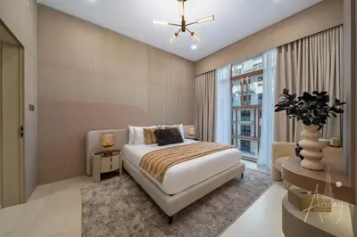 a bedroom with a bed and a window at Sweet Escape 1BR in JVC Near Circle Mall in Dubai