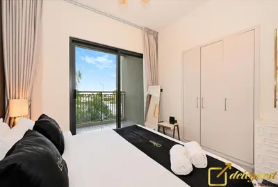 a bedroom with a large bed and a large window at Signature 3BR Maid Villa DH2 by Deleguest in Dubai