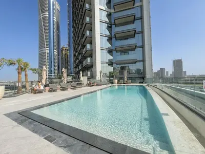 a swimming pool in the middle of a building at Boutique 1BHK at Nobles Tower By Czechin in Dubai