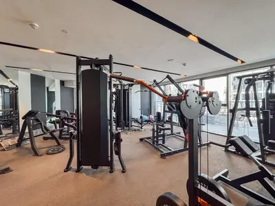 a gym with lots of equipment in a building at Boutique 1BHK at Nobles Tower By Czechin in Dubai