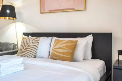a bedroom with a bed with pillows on it at Classy Studio ideal for long stays with balcony in Dubai
