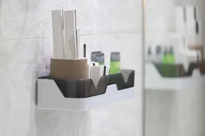 a bathroom with a mirror with a toothbrush holder on the wall at New studio in Arjan ideal for long stays in Dubai