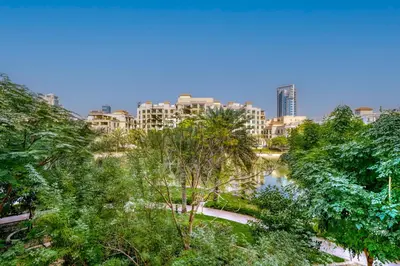 a view of a park with trees and buildings at Serene Studio at The Links Canal in Dubai